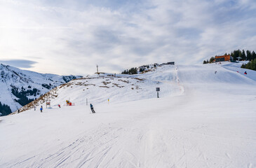 Obraz premium Wintry landscape on Hahnenkamm mountain in Austrian Alps in Kitzbuhel. Winter in Austria