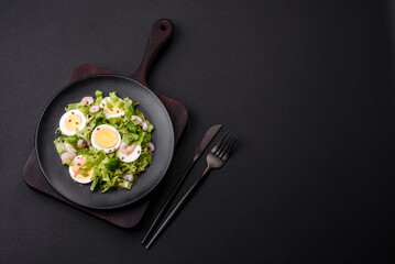 Delicious fresh healthy salad with shrimp, egg, lettuce and flax seeds