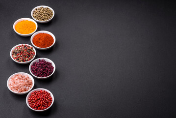 Composition consisting of a variation of several types of spices in white bowls