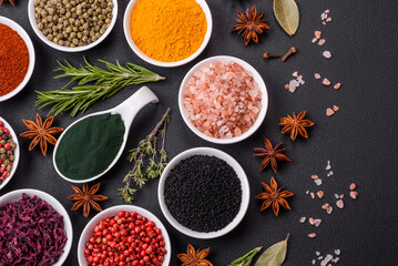 Composition consisting of a variation of several types of spices in white bowls