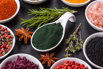 Composition consisting of a variation of several types of spices in white bowls