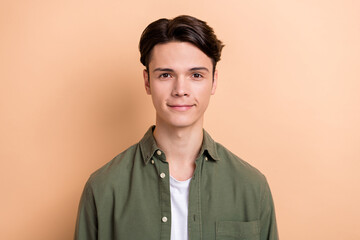 Photo of satisfied glad intelligent person smile good mood isolated on paste beige color background