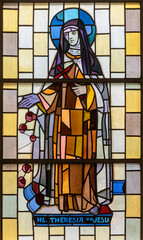 TASCH, SWITZERLAND - JULY 2, 2022: The stained glass with the St. Therese of the Child Jesus in the...