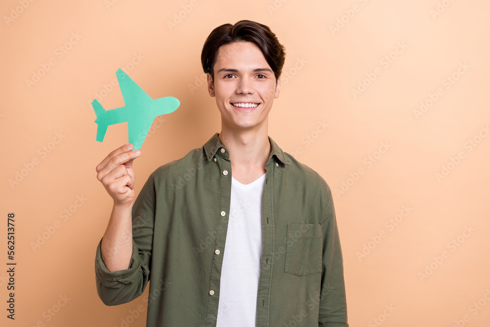 Sticker photo of young businessman smiling everyday flying trips entrepreneur hold paper airplane wearing kh