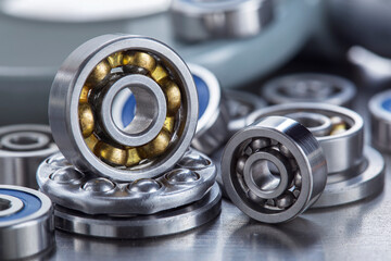 Obraz premium different bearings on a metal background. Part of mechanism.