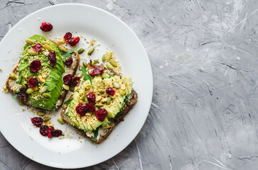 Healthy avocado toasts for breakfast or lunch with rye bread