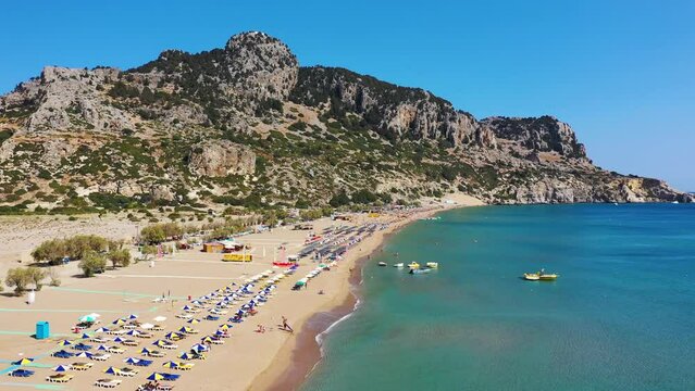 Tsampika beach with golden sand view from above, Rhodes, Greece. Aerial birds eye view of famous beach of Tsampika, Rhodes island, Dodecanese, Greece