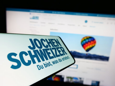 Stuttgart, Germany - 01-13-2023: Smartphone with logo of German company Jochen Schweizer GmbH on screen in front of business website. Focus on center of phone display.