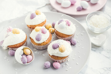 Glazed Easter cupcakes decorated with mini chocolate eggs