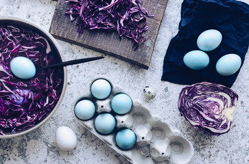 Dyed blue Easter eggs painted with natural dye red cabbage