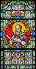 CHAMONIX, FRANCE - JULY 5, 2022: The  St. Francis de Sales on the stained glass in the church St. Michael by Antonine Bernard (1900).