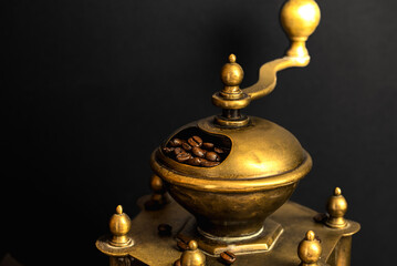 Fototapeta na wymiar Still life with coffee beans and old coffee grinder