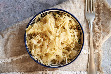 Fermented cabbage or sauerkraut with a fork