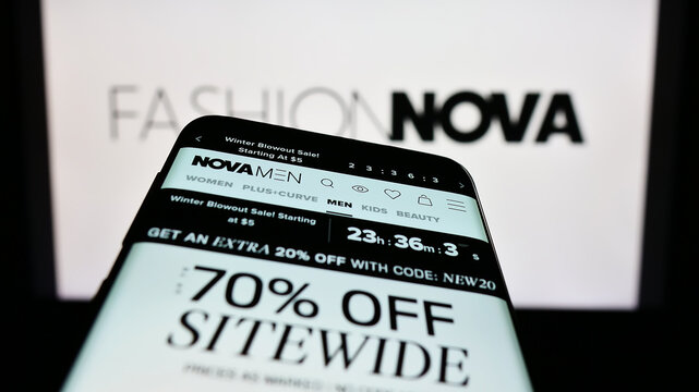 Stuttgart, Germany - 01-14-2023: Mobile phone with website of US e-commerce company Fashion Nova Inc. on screen in front of business logo. Focus on top-left of phone display.