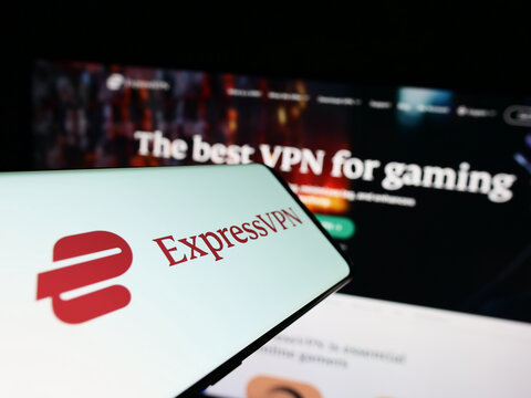 Stuttgart, Germany - 01-14-2023: Cellphone with logo of VPN service company ExpressVPN on screen in front of business business website. Focus on center-right of of phone display.