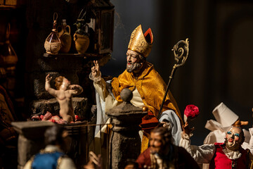 Fototapeta na wymiar priest at Christmas nativity scene folk art