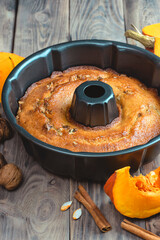 baking background. Bakery. Autumn baking table scene with pumpkin pie ingredients on a dark wood background.