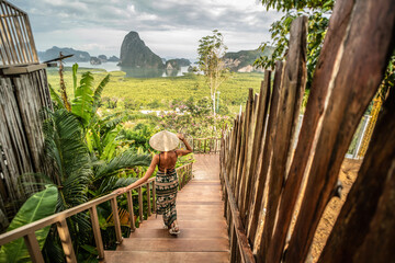 Solo traveler woman enjoying Phang Nga bay view point. Tourist at Samet Nang She, Thailand. Asia travel, trip and summer vacation concept. - obrazy, fototapety, plakaty