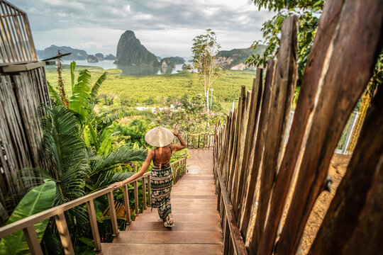 Solo traveler woman enjoying Phang Nga bay view point. Tourist at Samet Nang She, Thailand. Asia travel, trip and summer vacation concept.