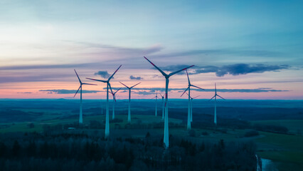 aerial view of a wind farm at dawn