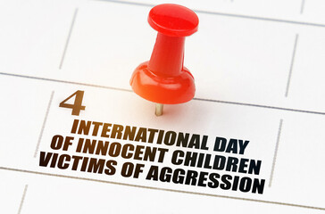 On the calendar grid, the date and name of the holiday - International Day of Innocent Children Victims of Aggression