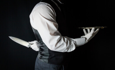 Butler or Waiter With Serving Tray and Holding Sharp Knife Behind Back. Concept of Butler Did It....