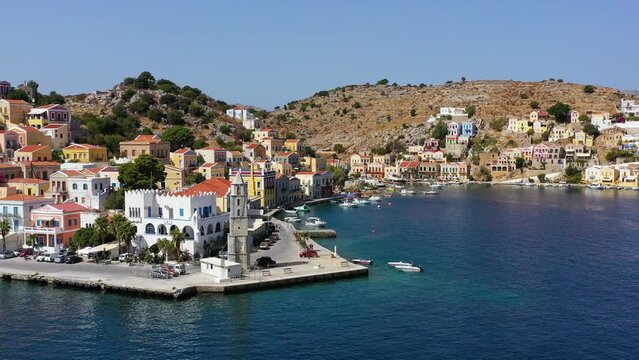Aerial view of the beautiful greek island of Symi (Simi) with colourful houses and small boats. Greece, Symi island, view of the town of Symi (near Rhodes), Dodecanese.