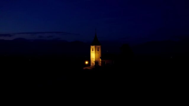 The Church of St. Primož and Felicijan drone 4K dlog footage, night autumn mood, Jamnik, Slovenia