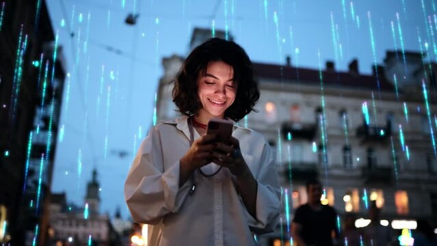 Beautiful Smiling Woman Using Smartphone on a City Street at Night. Visualization of the Internet by information lines flying to the global digital network. Wireless communication network concept