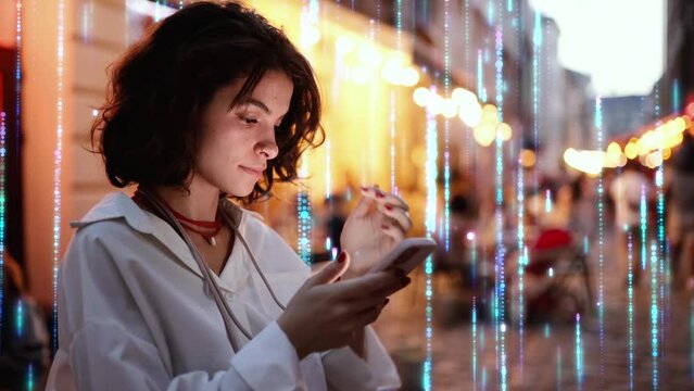 Beautiful Smiling Woman Using Phone on a City Street at Night. Visualization of the Internet by information lines flying to the global digital network. Wireless communication network concept