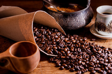 Still life with coffee beans and vintage sugar bowl.