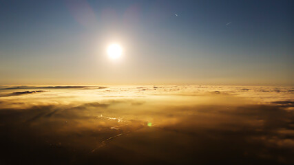 Fototapeta na wymiar Morning, sunrise. Shooting with a drone above the morning fog.