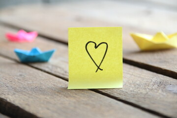 Heart on a paper tag. Birthday background.. Valentine's Day idea.