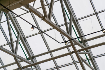 Metal framed glass roof of modern building. Fastening of Glass on the Facade