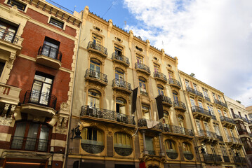 Facade building. Residential building with balconies and windows. Historical apartment house. House with window and balcony. Buildings architecture and home facade. Modern minimalistic architecture.