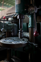 Part machining with drilling machine