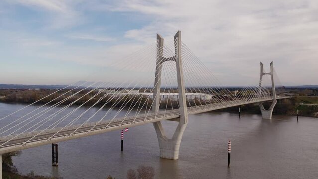 Drone view of cars crossing a cable-stayed bridge over the Rh&ocirc;ne river