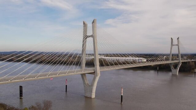 Cars crossing a Cable-stayed Suspension bridge across the Rh&ocirc;ne river 