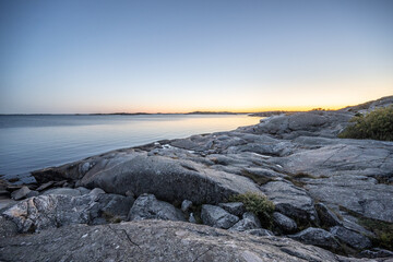 Rounded cliffs by the sea at late night.