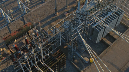 High voltage substation with pylons and distribution cables. Transformation station and electric...