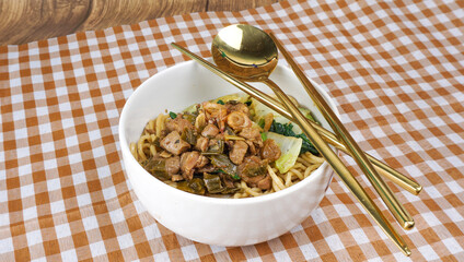 Stir fried noodle with chicken and vegetable. Indonesian street food