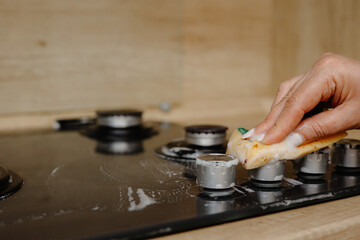 the person washes the stove	