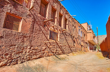 The old building of Abyaneh village, made of stones, mud bricks and reddish clay with timber...