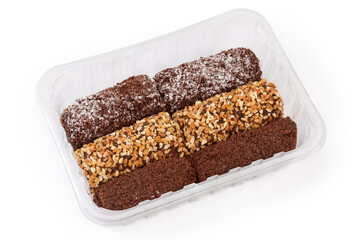 Small soft chocolate cakes with different sprinkling in plastic container