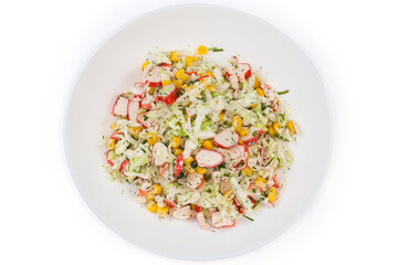 Salad of crab sticks, napa cabbage on dish, top view