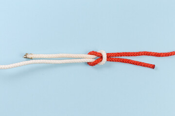 Rope thief knot on a blue background