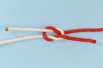 Rope grief knot on a blue background
