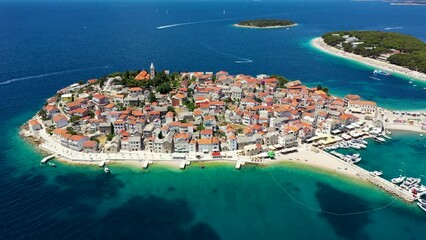 Aerial view of Primosten old town on the islet, Dalmatia, Croatia. Primosten, Sibenik Knin County, Croatia. Resort town on the Adriatic coast. Aerial view of adriatic town Primosten, Croatia