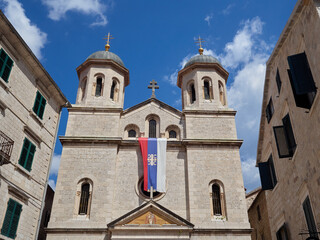 Facade of the Church of St. Nicholas in Kotor Old Town with two towers with domes. Montenegro, Europe