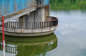 Fototapeta na wymiar metal dam damming water on the river